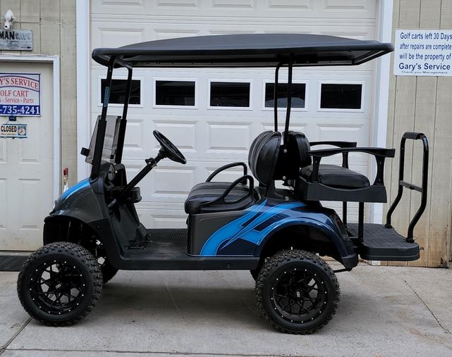A golf cart with a black and blue color scheme.